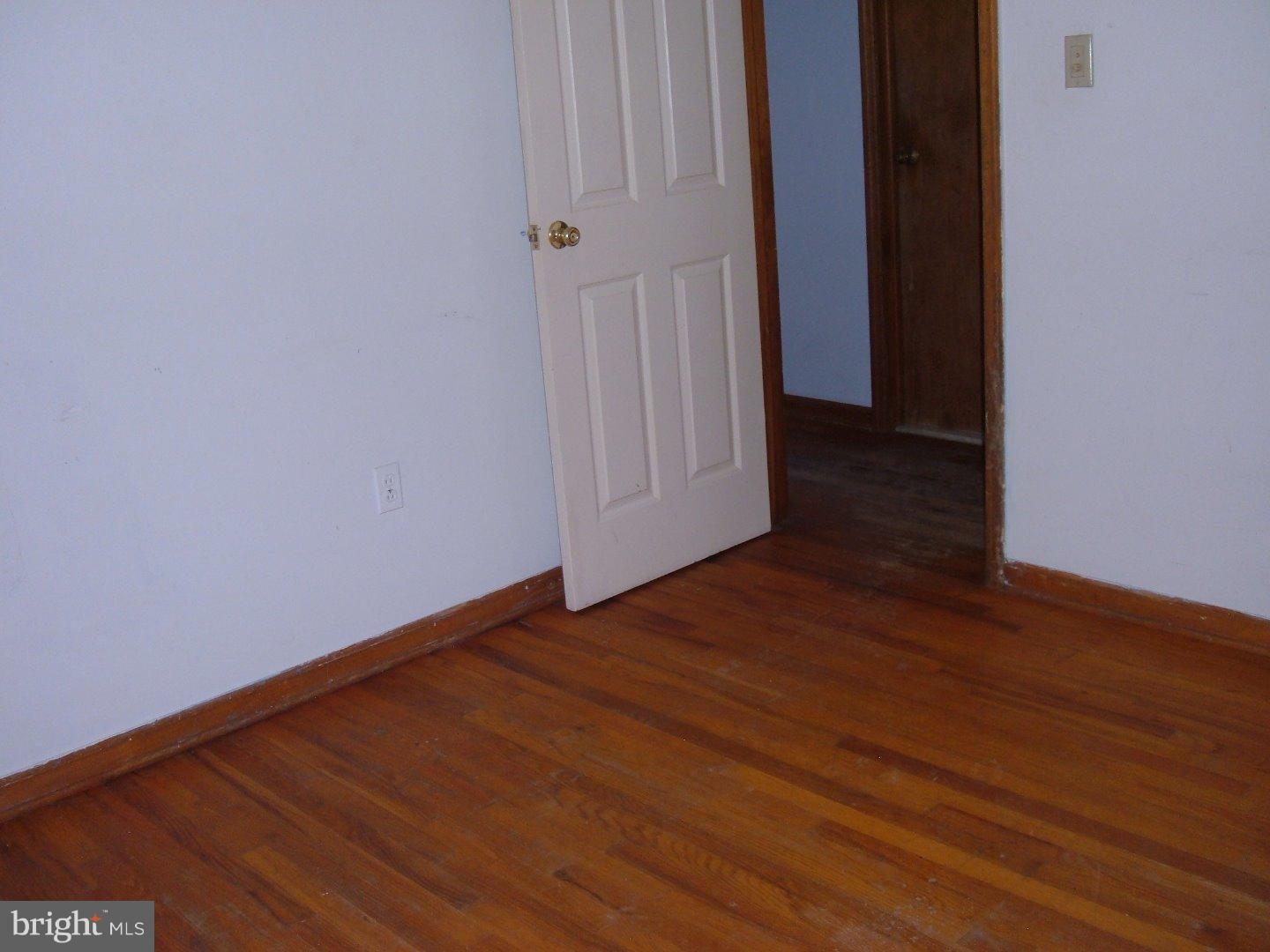 114 Scrapetown Road Pemberton, NJ 08068 - Photo 12 of 23 a view of an empty room with wooden floor and a window
