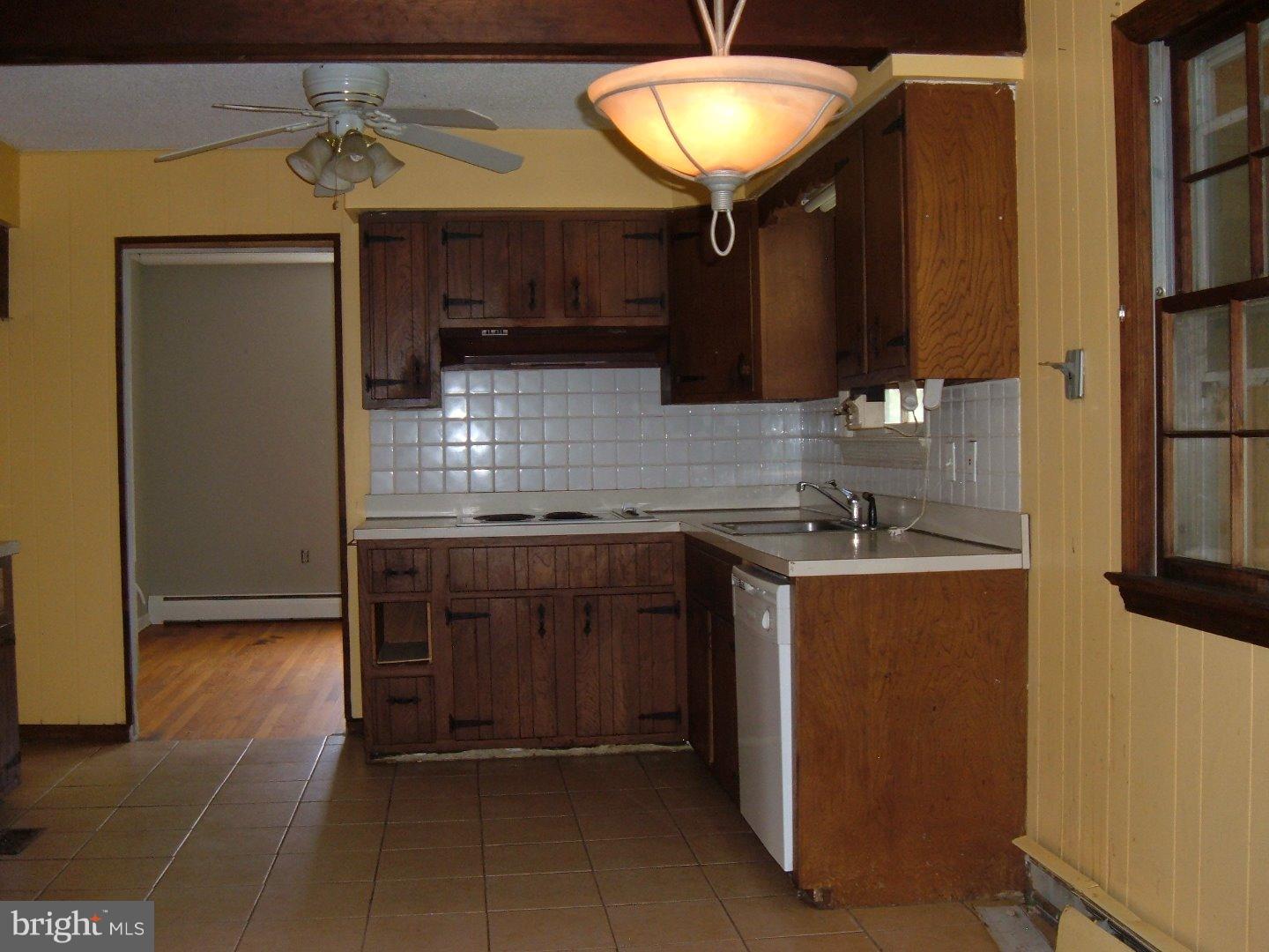 114 Scrapetown Road Pemberton, NJ 08068 - Photo 4 of 23 a kitchen with stainless steel appliances granite countertop a sink and a refrigerator