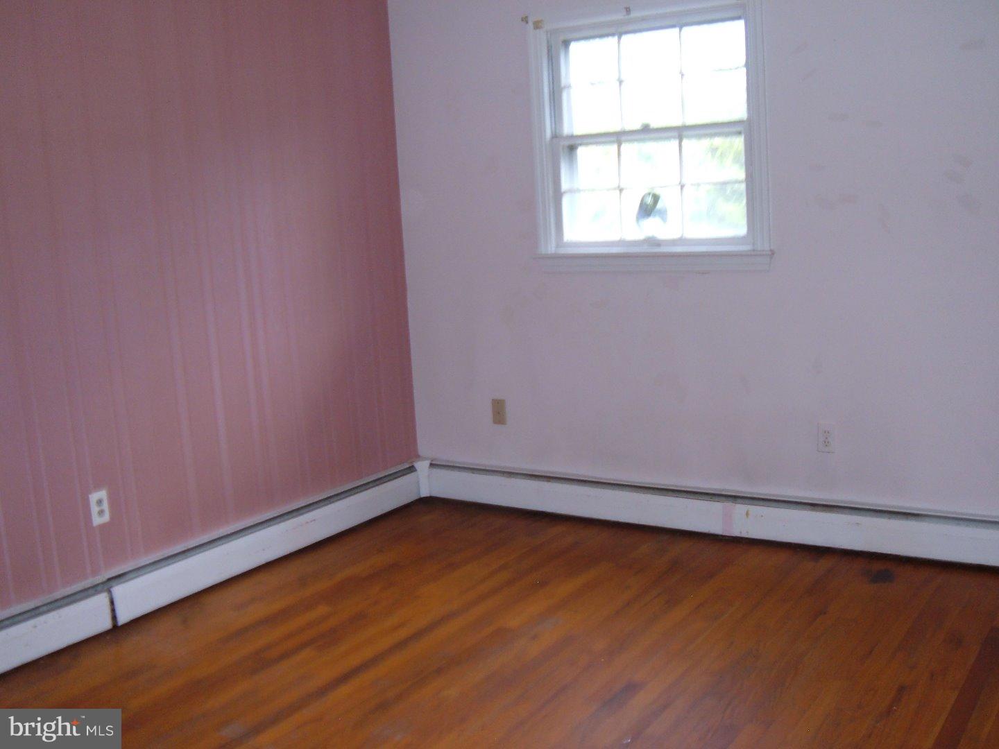 114 Scrapetown Road Pemberton, NJ 08068 - Photo 9 of 23 an empty room with wooden floor and windows