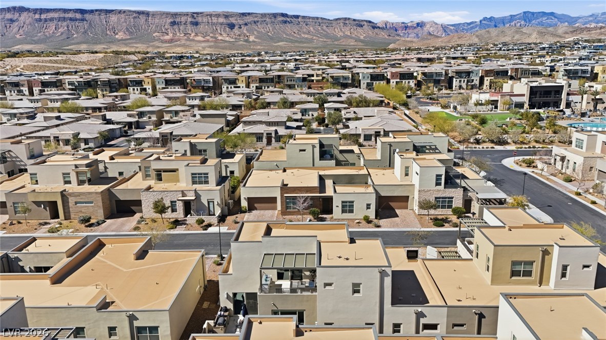 4246 Swift Street Las Vegas, NV 89135 - Photo 57 of 71 Aerial perspective of suburban area with a mountain backdrop