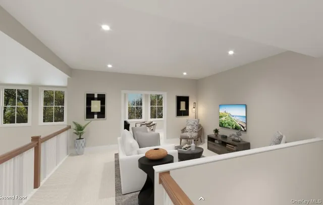 a living room with furniture and large windows