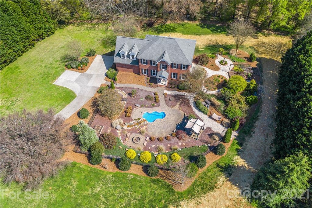 8866 Collins Road Indian Land, SC 29707 - Photo 1 of 48 an aerial view of house with yard swimming pool and outdoor seating