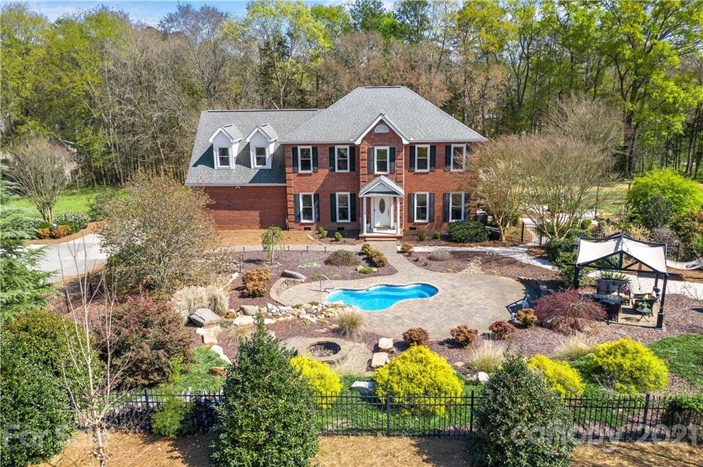 8866 Collins Road Indian Land, SC 29707 - Photo 2 of 48 a front view of a house with garden