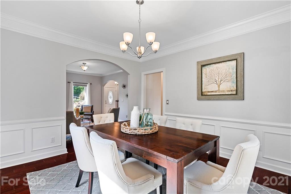 8866 Collins Road Indian Land, SC 29707 - Photo 12 of 48 a view of a dining room with furniture and wooden floor