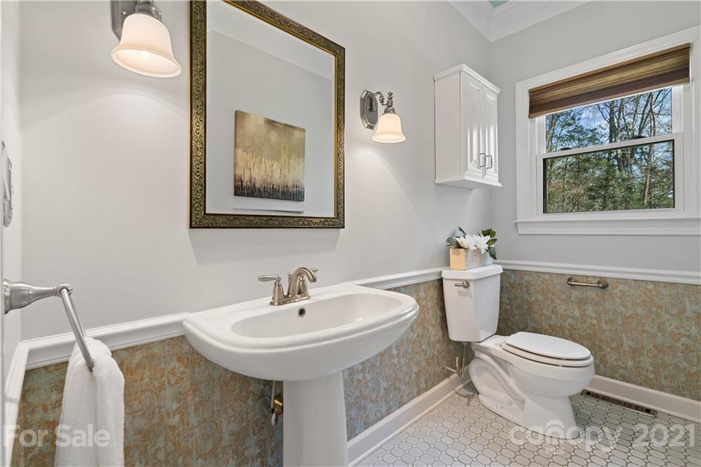 8866 Collins Road Indian Land, SC 29707 - Photo 16 of 48 a bathroom with a sink a toilet and mirror