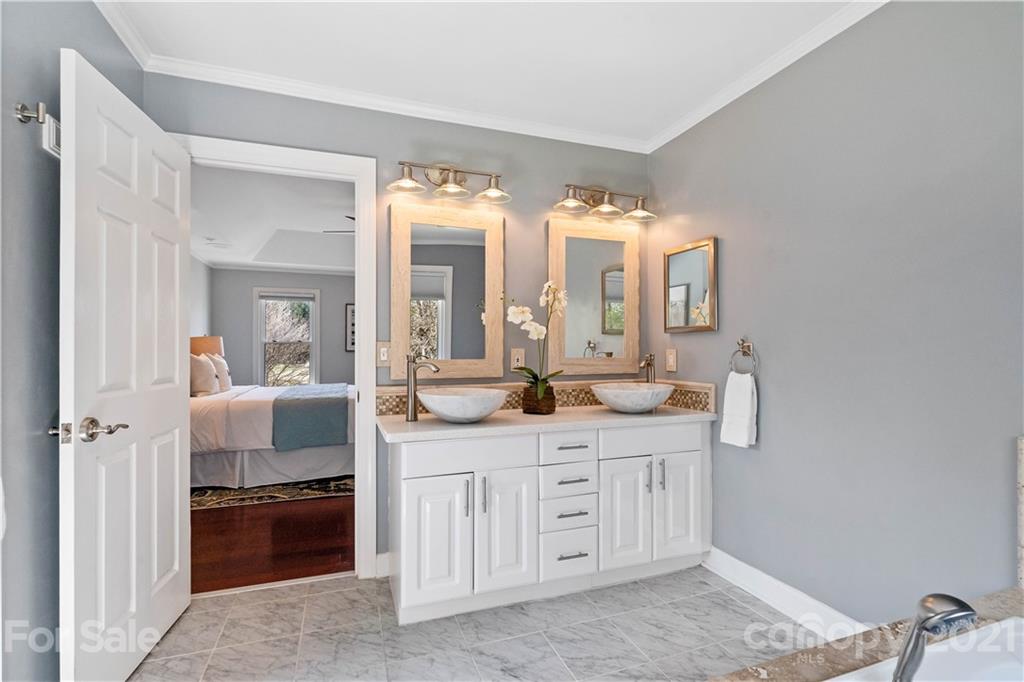 8866 Collins Road Indian Land, SC 29707 - Photo 21 of 48 a en suite bathroom with a double vanity sink and a mirror