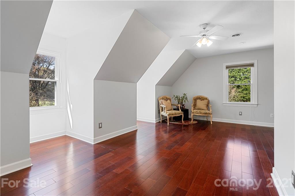 8866 Collins Road Indian Land, SC 29707 - Photo 25 of 48 an empty room with furniture and wooden floor