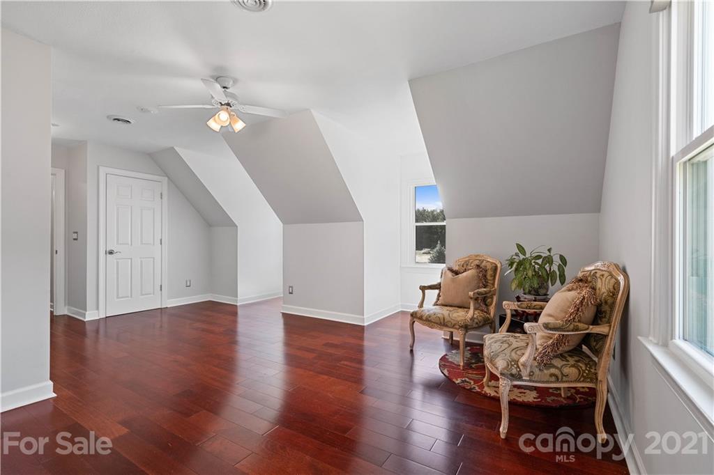8866 Collins Road Indian Land, SC 29707 - Photo 26 of 48 a living room with furniture and wooden floor