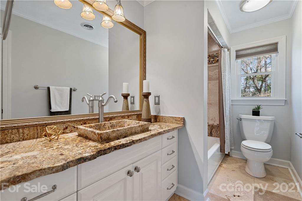 8866 Collins Road Indian Land, SC 29707 - Photo 29 of 48 a bathroom with a granite countertop sink and a mirror