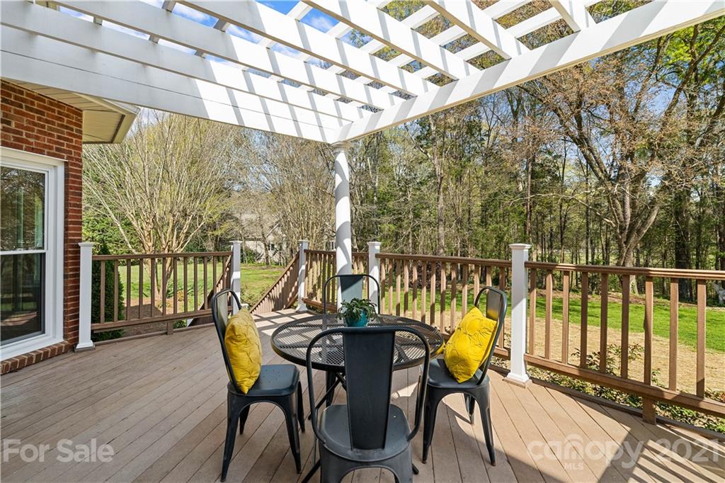 8866 Collins Road Indian Land, SC 29707 - Photo 31 of 48 a view of a chairs and table in the balcony