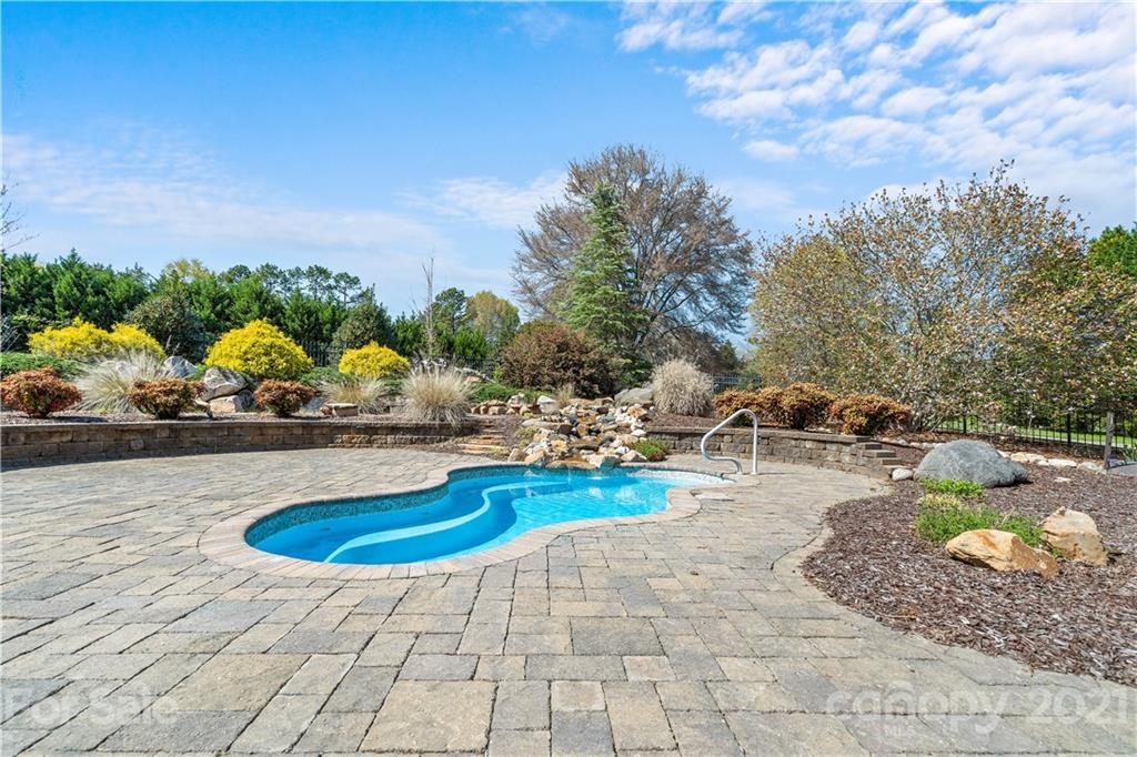 8866 Collins Road Indian Land, SC 29707 - Photo 34 of 48 a view of a swimming pool with lounge chair
