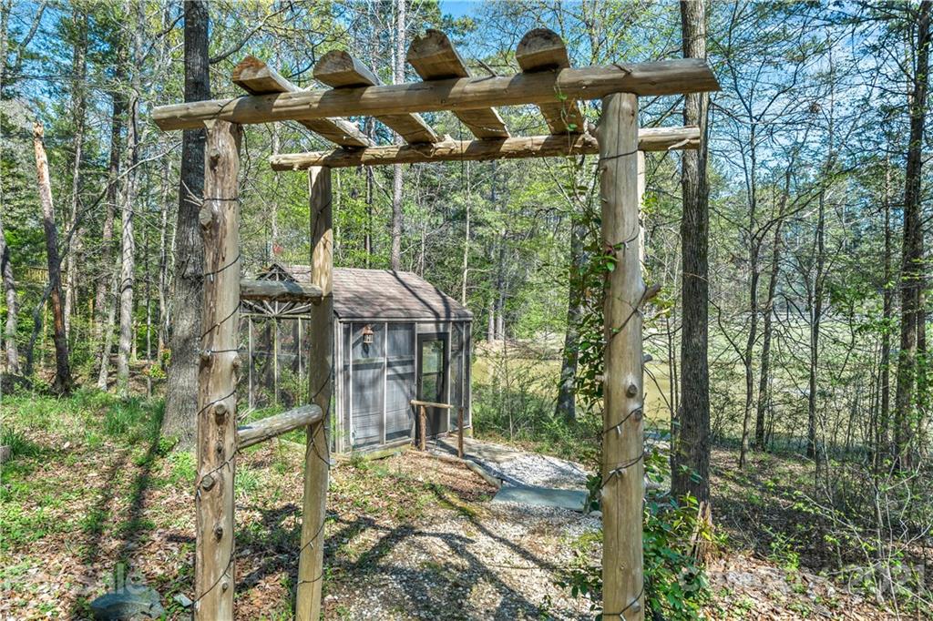 8866 Collins Road Indian Land, SC 29707 - Photo 40 of 48 a view of a house with backyard and sitting area