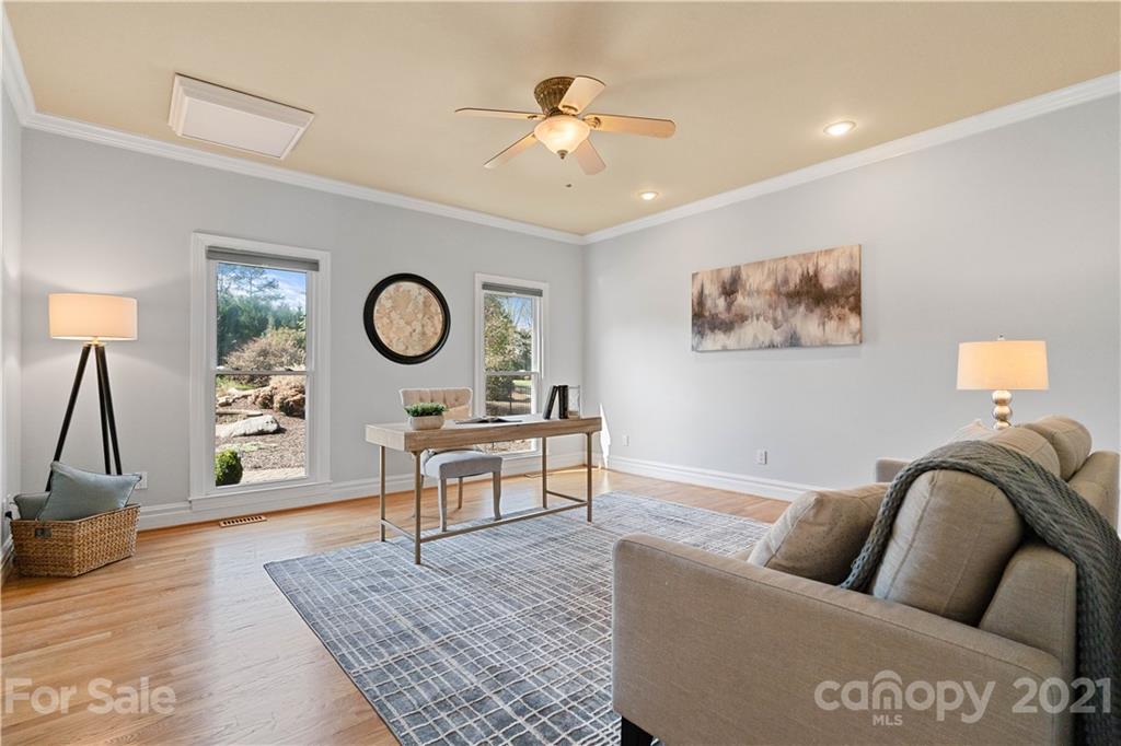 8866 Collins Road Indian Land, SC 29707 - Photo 6 of 48 a living room with furniture and wooden floor