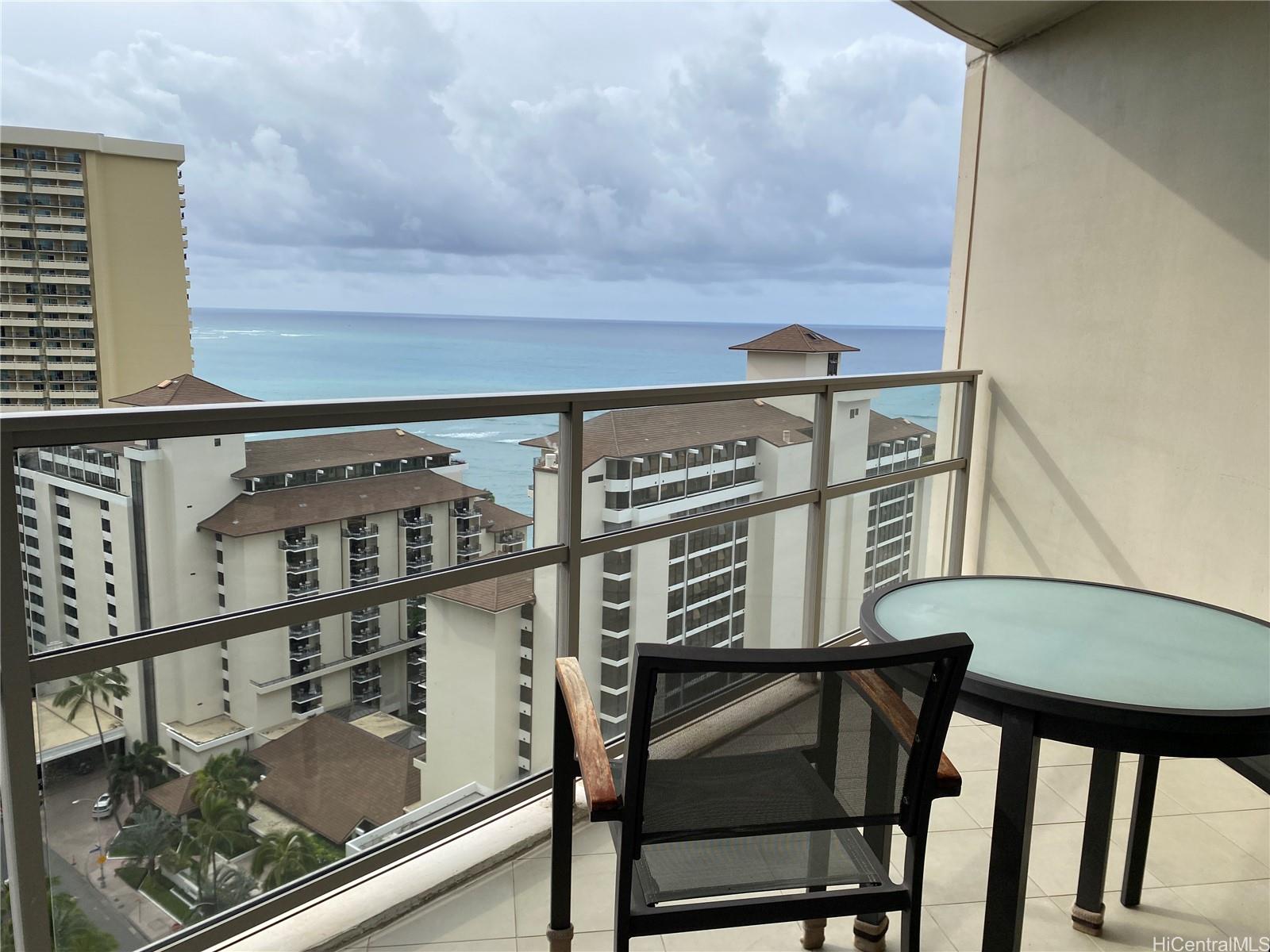 223 Saratoga Road, Unit 2220 Honolulu, HI 96815 - Photo 2 of 15 a view of a balcony with chair and table