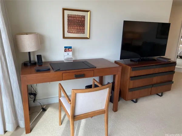 a room with furniture and a flat screen tv