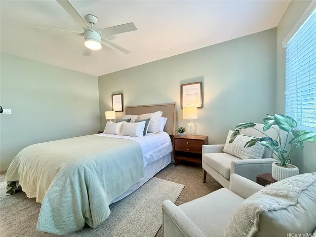 a bedroom with bed and window