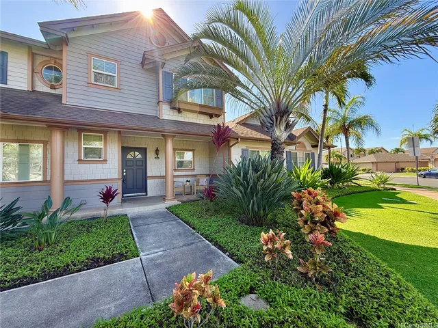 a front view of a house with garden
