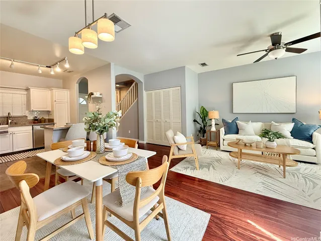 a view of a dining room with furniture and chandelier