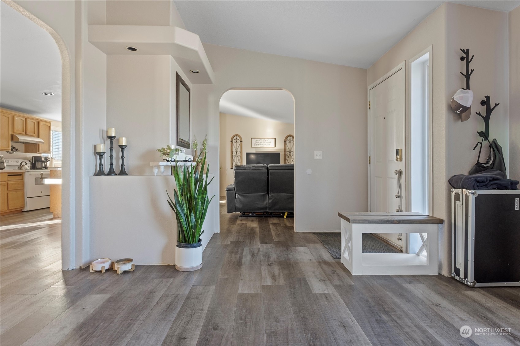 698 South Canal Road Othello, WA 99344 - Photo 13 of 40 a view of a hallway with wooden floor and a living room