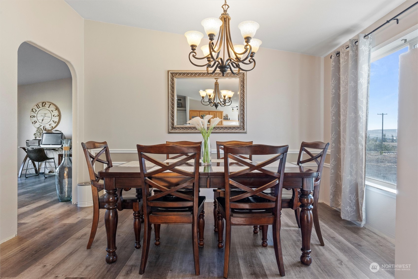 698 South Canal Road Othello, WA 99344 - Photo 20 of 40 a view of a dining room with furniture wooden floor and chandelier