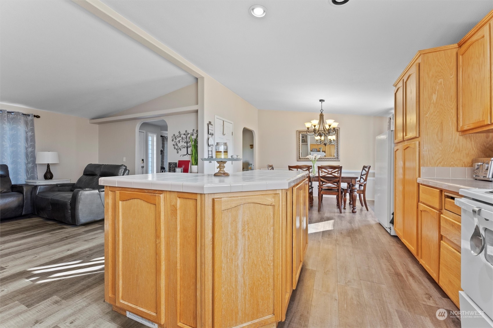 698 South Canal Road Othello, WA 99344 - Photo 24 of 40 a dining hall with stainless steel appliances granite countertop a refrigerator a sink dishwasher a couches with chairs and wooden floor