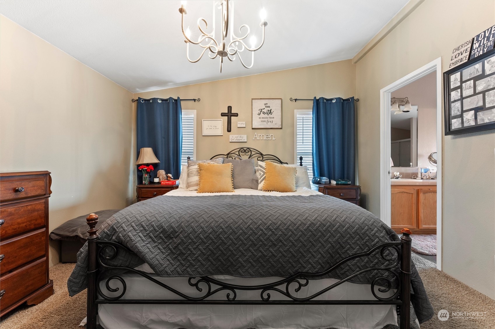 698 South Canal Road Othello, WA 99344 - Photo 25 of 40 a bedroom with a bed and a chandelier