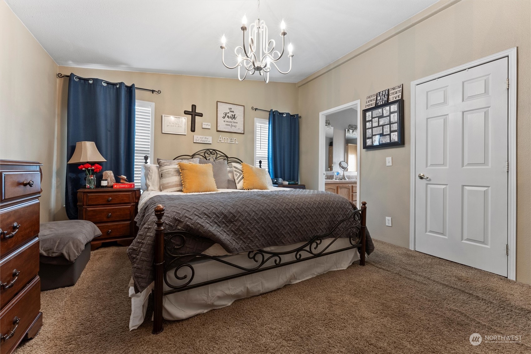 698 South Canal Road Othello, WA 99344 - Photo 26 of 40 a bedroom with a bed and a chandelier