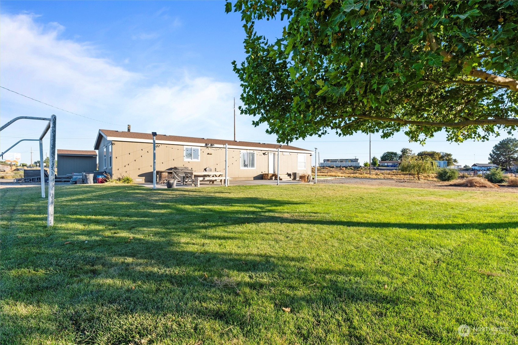 698 South Canal Road Othello, WA 99344 - Photo 35 of 40 a view of a house with a big yard and sitting area