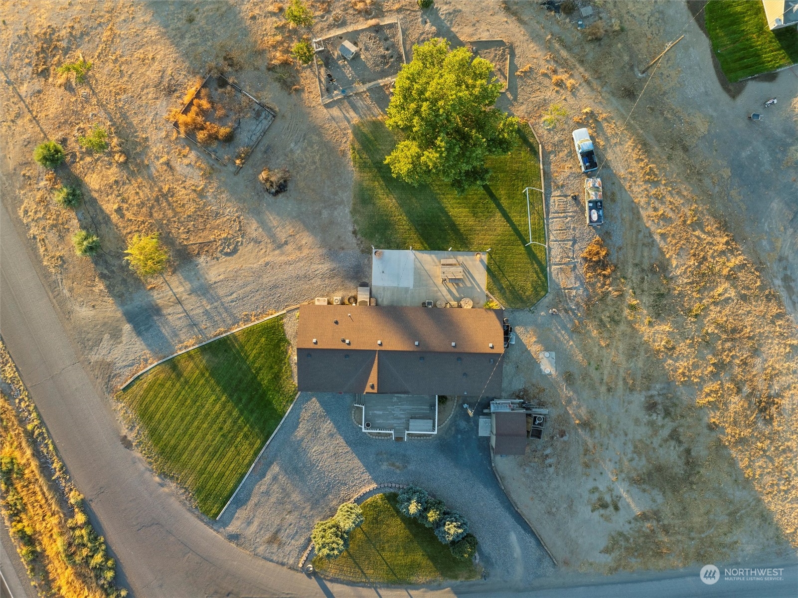 698 South Canal Road Othello, WA 99344 - Photo 9 of 40 an aerial view of a house with a yard and garden