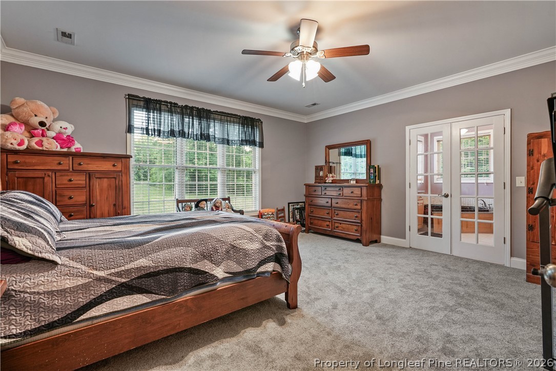 280 Hemp St Extension Robbins, NC 27325 - Photo 15 of 29 a bed sitting in a spacious bedroom next to a window