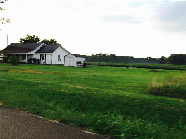 3864 Yeargan Road Murfreesboro, TN 37128 - Photo 7 of 7 a view of a big house with a big yard and large trees