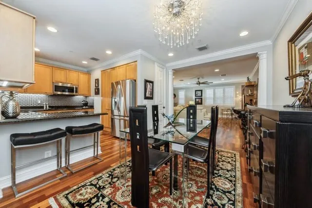 a view of a dining room with furniture window and wooden floor