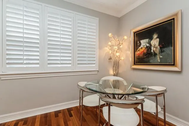 a view of a dining room with furniture and window