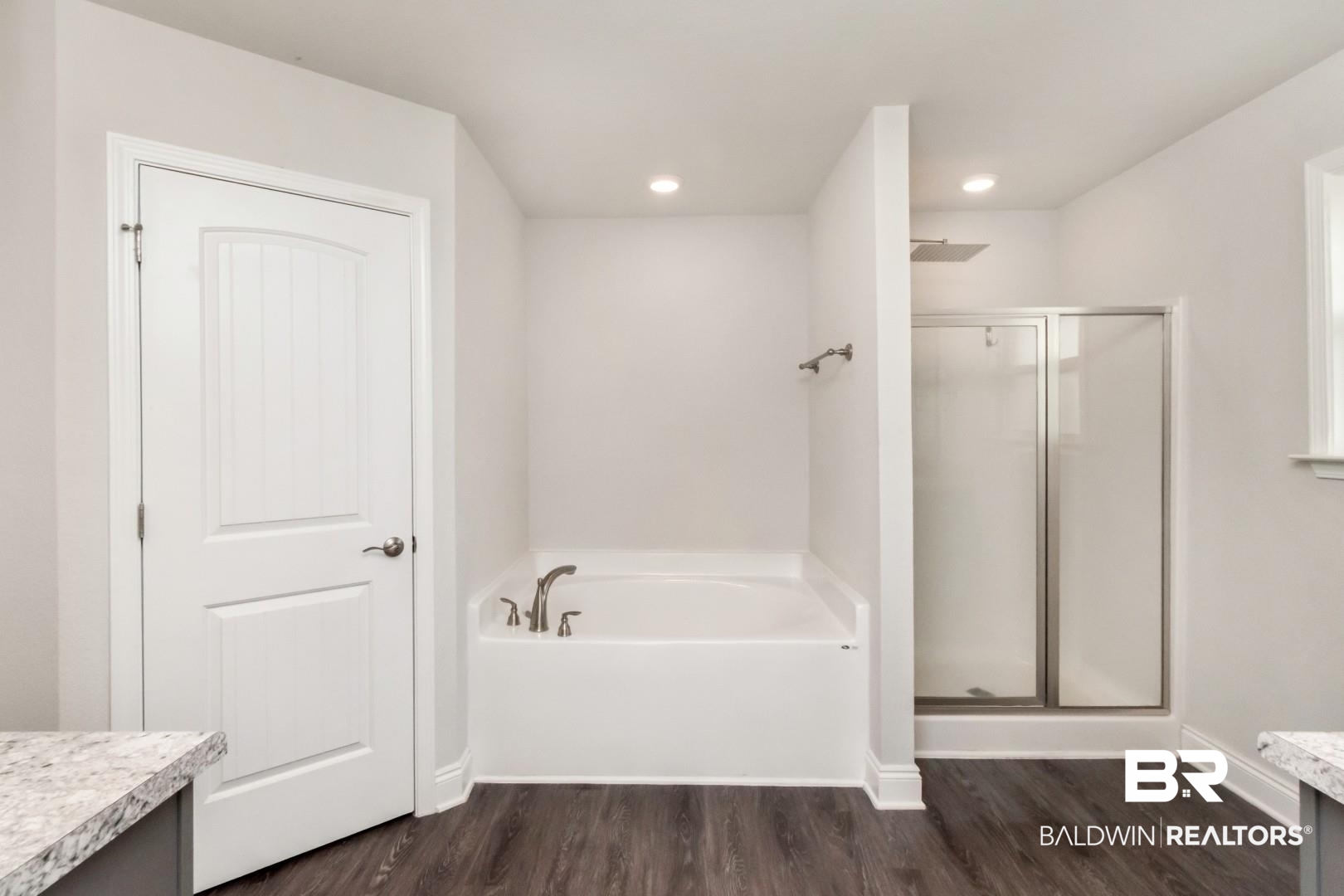 6632 Monarch Circle Mobile, AL 36618 - Photo 19 of 32 Full bath with vanity, a shower stall, a garden tub, dark wood-style flooring, and recessed lighting