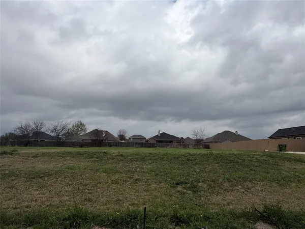 a view of houses with outdoor space and mountain view in back