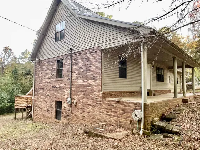 a front view of a house with parking area
