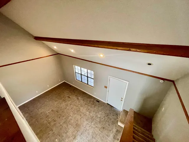 a view of a room with window and stairs