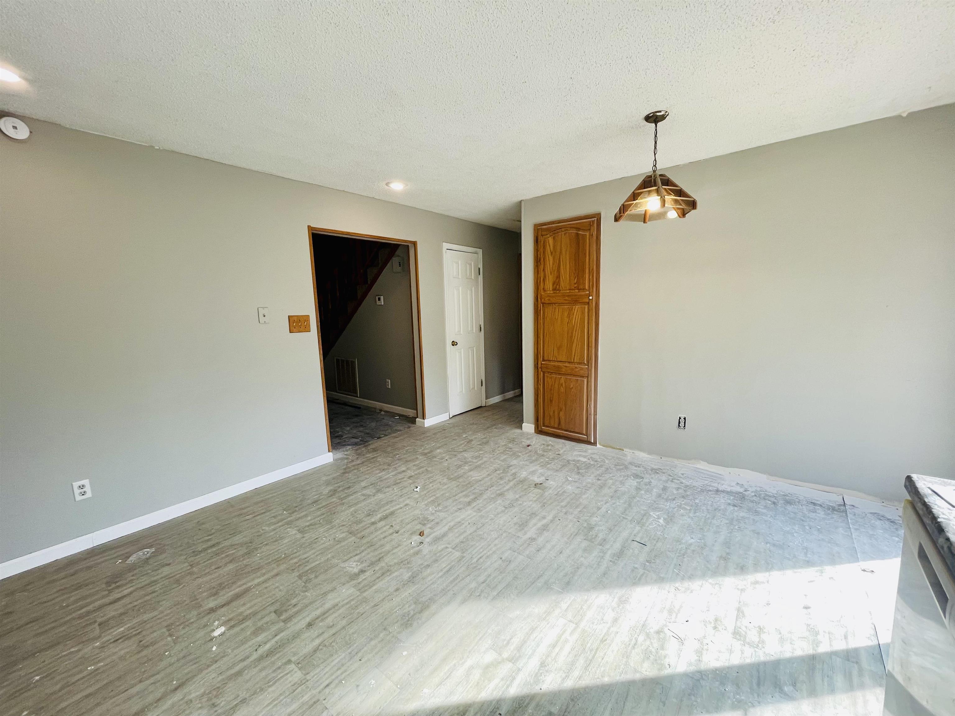 26 Cr 341 Road Iuka, MS 38852 - Photo 6 of 21 an empty room with wooden floor and hallway