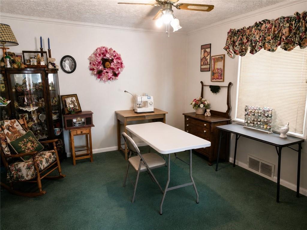 741 Center Avenue Butler, PA 16001 - Photo 11 of 27 a view of a room that has a table and chairs in it