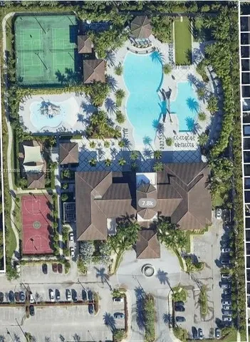 an aerial view of a house with a lake view