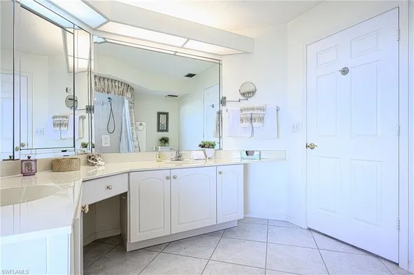 a bathroom with a sink vanity and a toilet