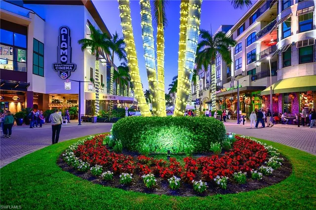 a group of people sitting in front of a building