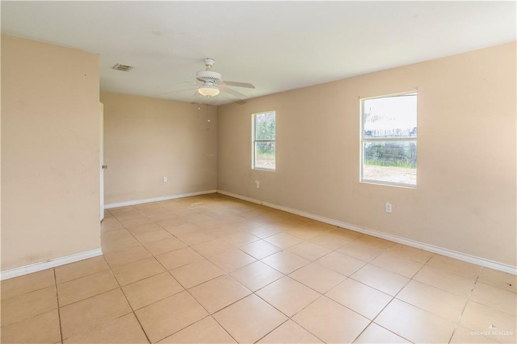 21440 Sunflower Road Edinburg, TX 78542 - Photo 9 of 25 a view of an empty room with a window