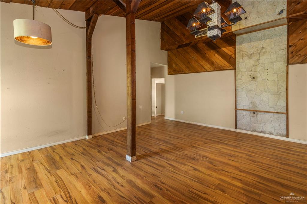21440 Sunflower Road Edinburg, TX 78542 - Photo 10 of 25 a view of a room with wooden floor and a window
