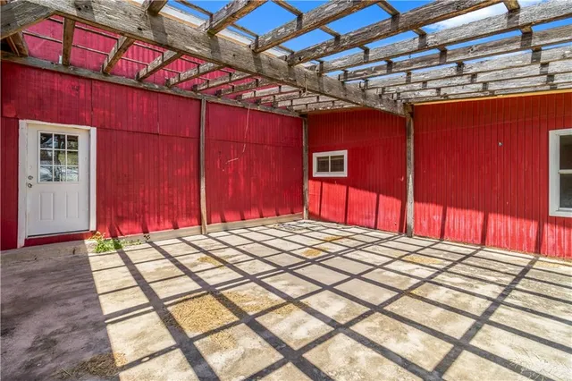 a bathroom with a granite countertop toilet and a sink