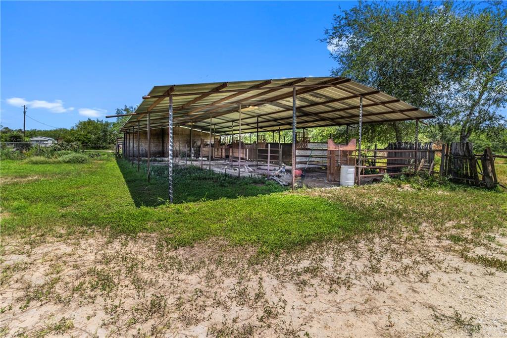 21440 Sunflower Road Edinburg, TX 78542 - Photo 16 of 25 a view of a chair and table in backyard of the house