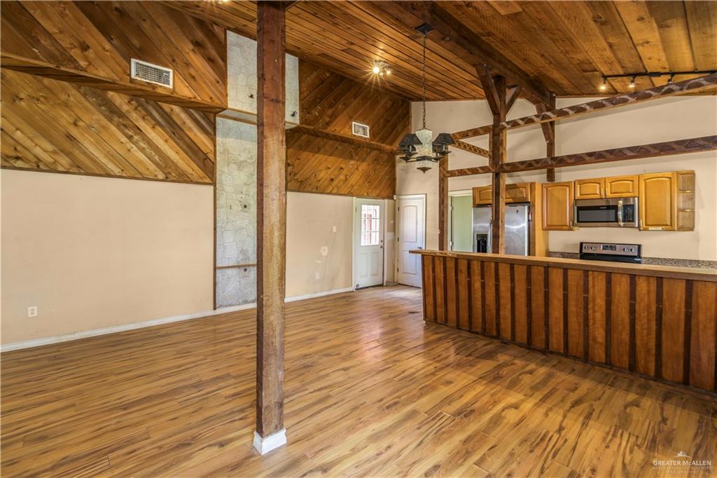 21440 Sunflower Road Edinburg, TX 78542 - Photo 25 of 25 a view of a porch with wooden floor