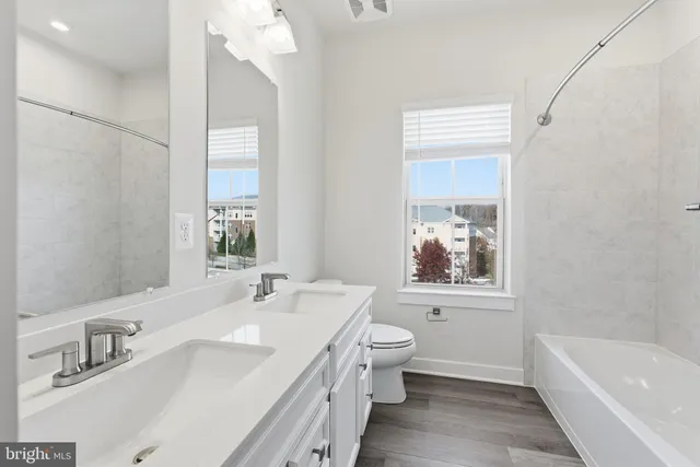 a bathroom with a bathtub sink and toilet