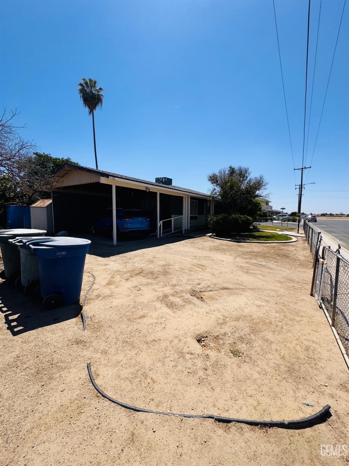 Undisclosed Address Delano, CA 93215 - Photo 15 of 18 a view of a swimming pool with a chair