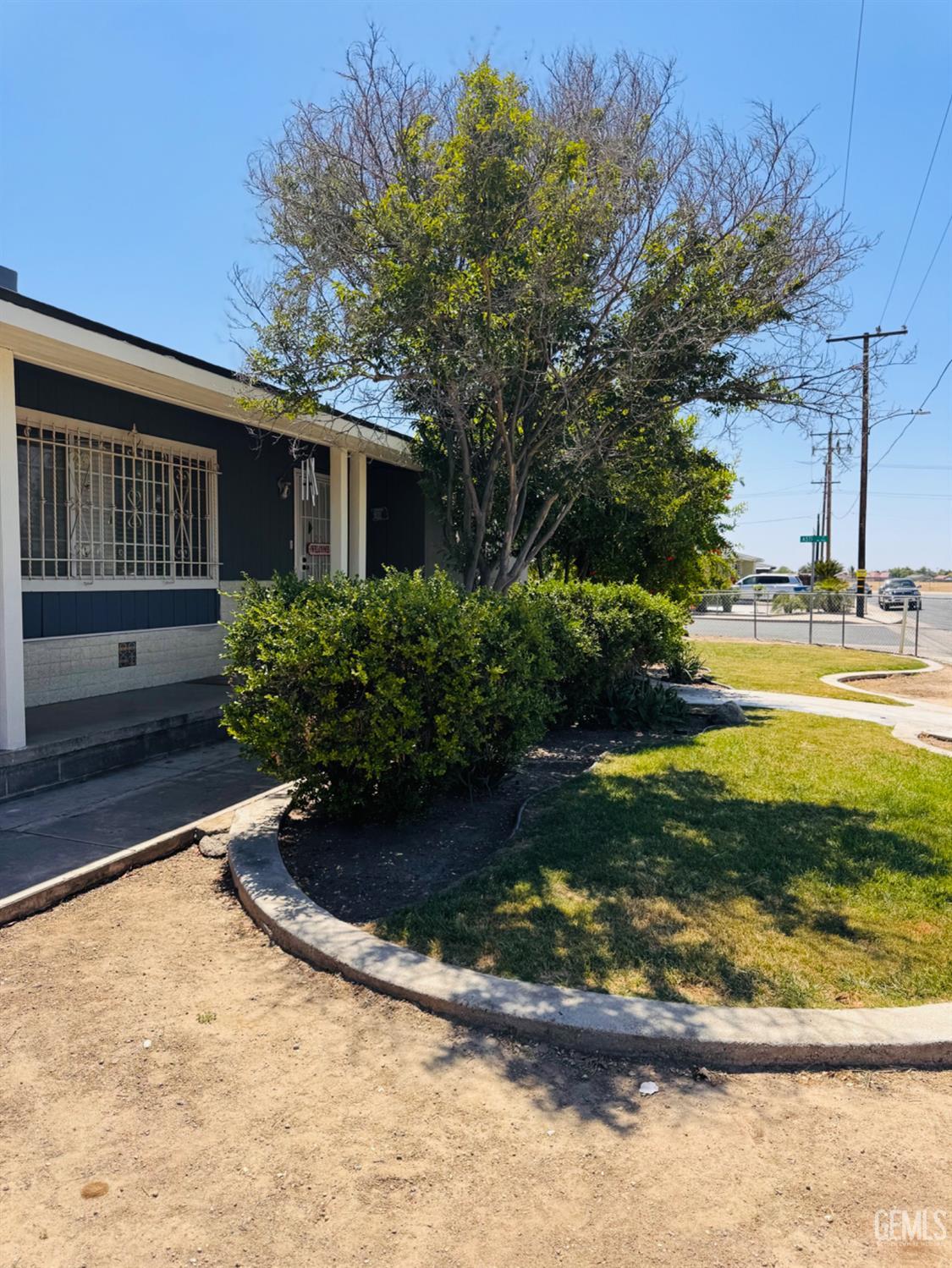 Undisclosed Address Delano, CA 93215 - Photo 3 of 18 a view of a backyard with plants and outdoor seating
